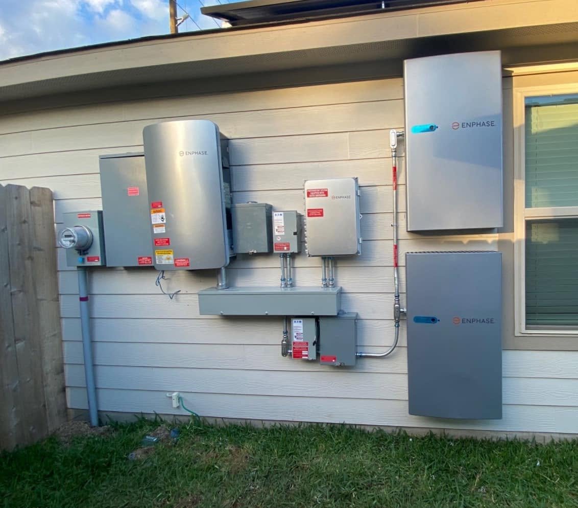 Battery backup and inverter system installed on exterior wall